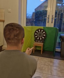 Lewis on his electronic dartboard