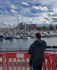 Nathan watching the boats at the Marina