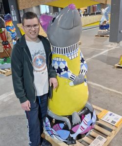 Nathan with his favourite rat statue a huge achievement